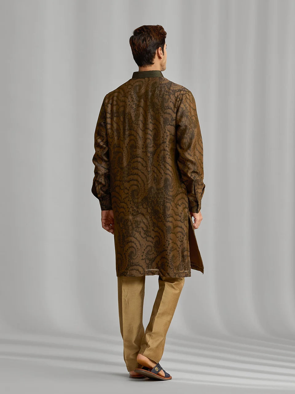Olive silk-blend kurta with rhythmic print, paired with antique gold Aligarhi pants.
