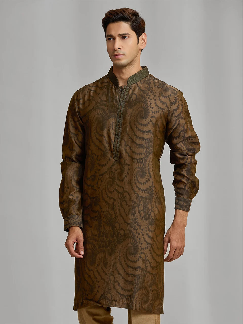 Olive silk-blend kurta with rhythmic print, paired with antique gold Aligarhi pants.
